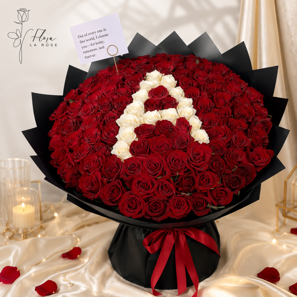 Luxury red and white rose bouquet in Dubai with black wrapping and red ribbon by Flora La Rose